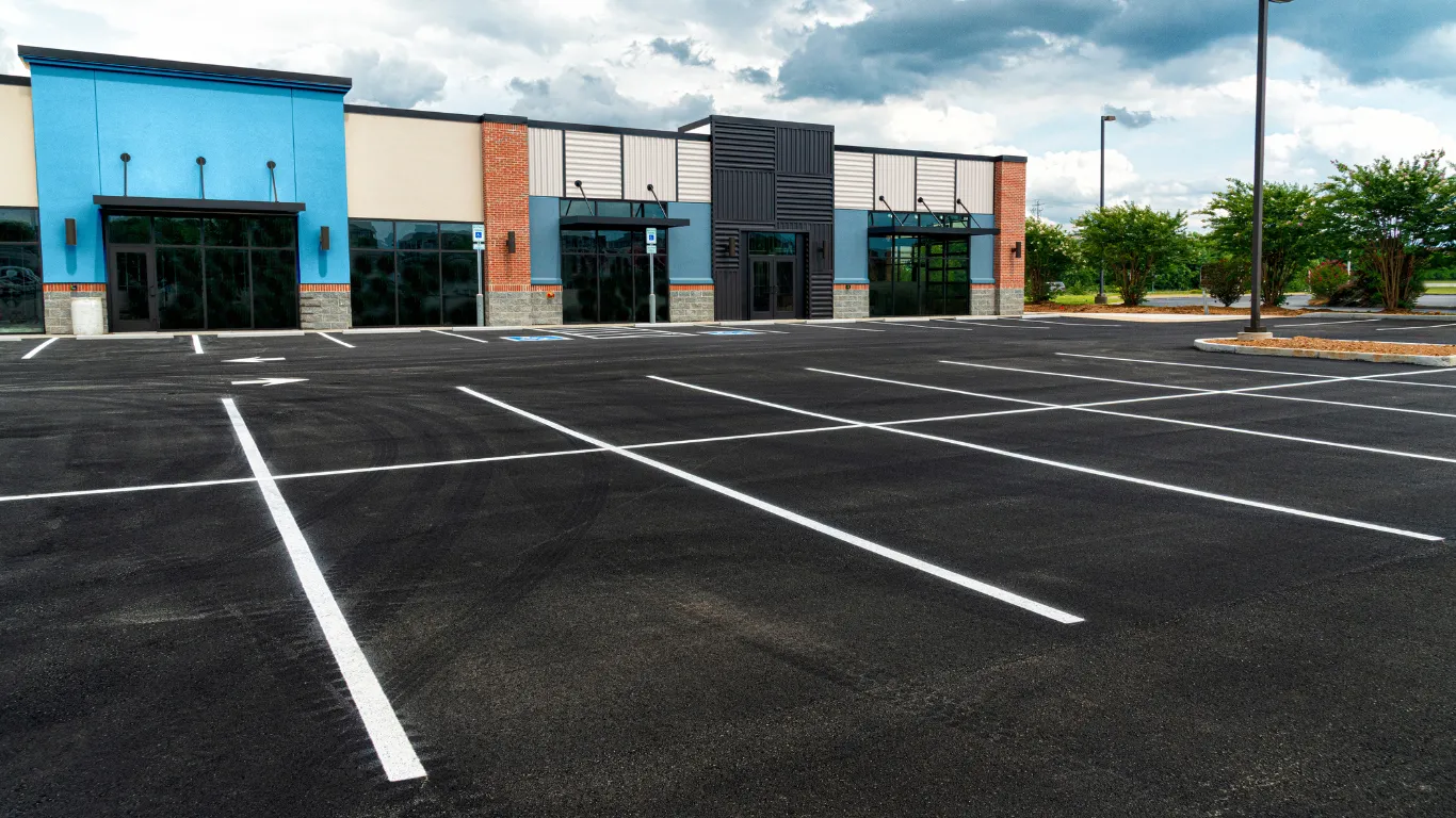 Commercial remodeling project in Los Angeles with updated retail building exterior, storefront entrances, parking lot, modern facade, and business property improvement
