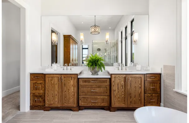 Bathroom remodel with double vanity and wood cabinets in Los Angeles