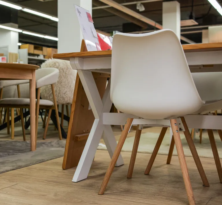 Commercial remodeling in Los Angeles with office showroom interior, modern furniture displays, wood flooring, work tables, and updated business space