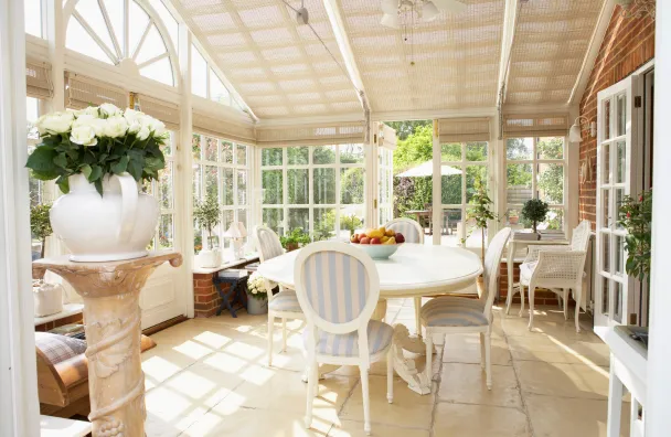 Room additions in Los Angeles with sunroom dining extension, large windows, natural light, patio access, and expanded indoor living space